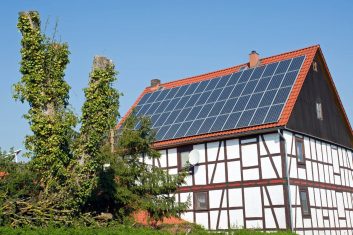 old-frame-house-with-solar-cells-on-the-roof-1